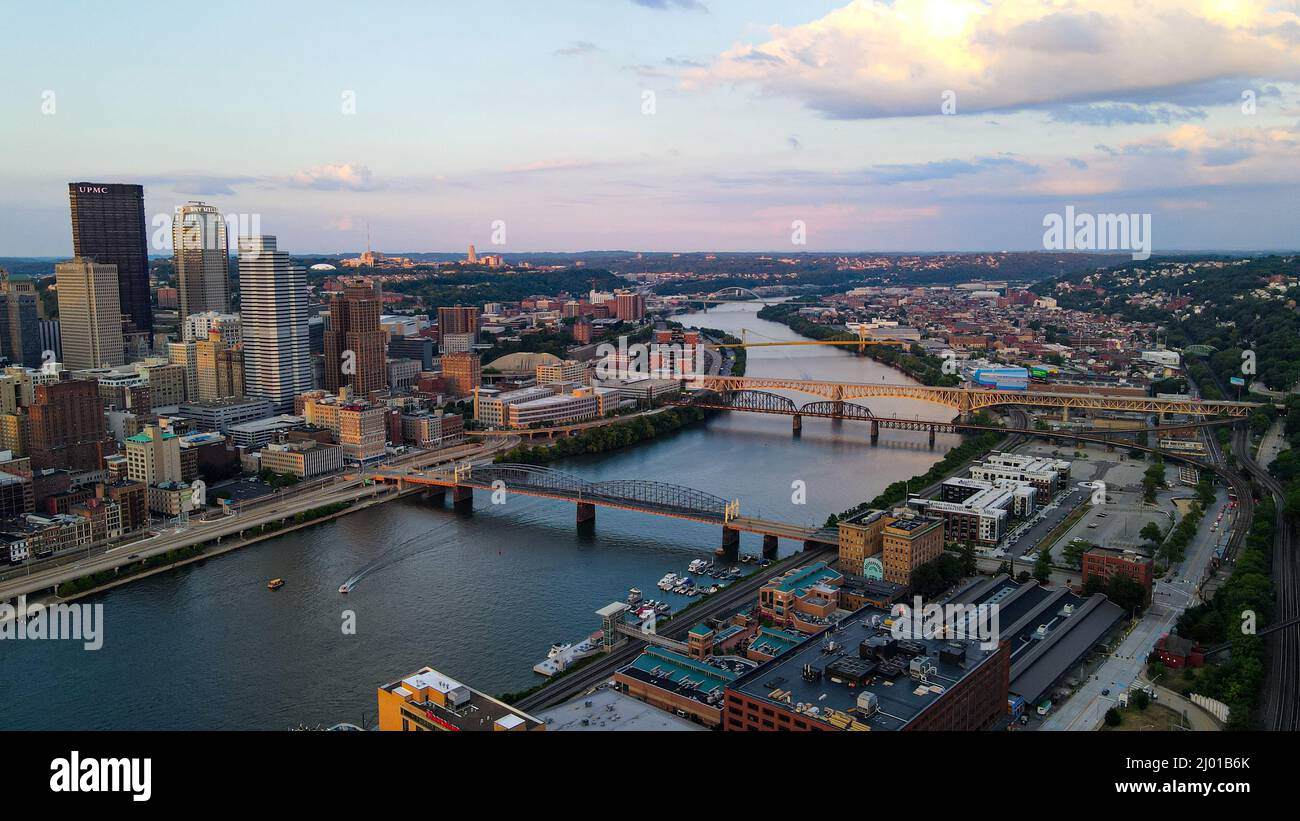 Aerial view of a big city with skyscrapers and a river with bridges in ...