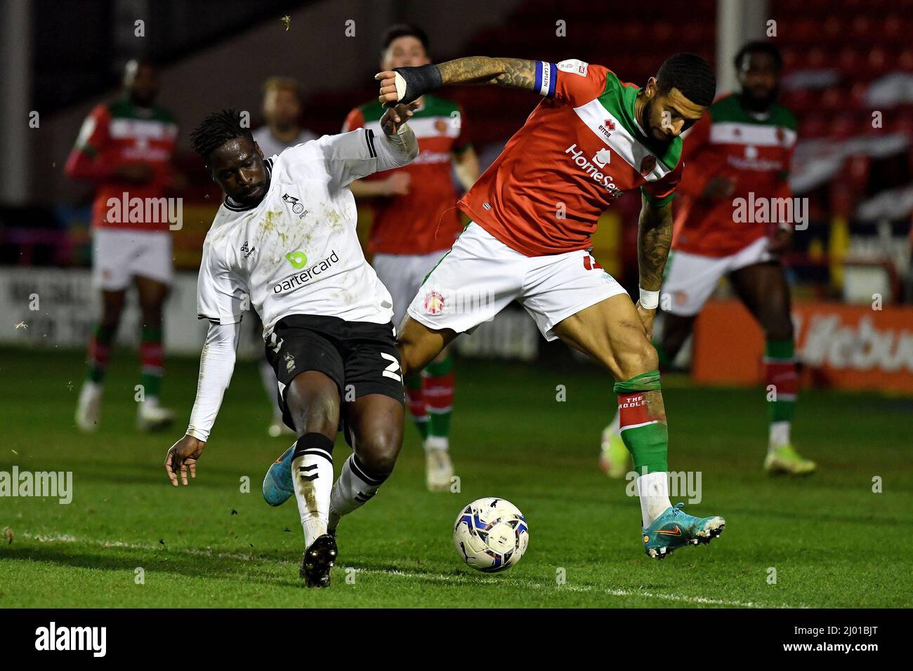 WALSALL, UK. MAR 15TH Oldham Athletic's Christopher Missilou tussles with Joss Labadie of Walsall Football Club during the Sky Bet League 2 match between Walsall and Oldham Athletic at the Banks's Stadium, Walsall on Tuesday 15th March 2022. (Credit: Eddie Garvey | MI News) Credit: MI News & Sport /Alamy Live News Stock Photo