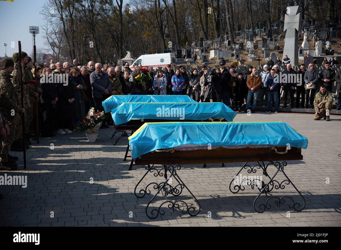 Lviv, Ukraine. 15th Mar, 2022. The caskets of three Ukrainian soldiers. Three Ukrainian soldiers killed in the March 13th missile attack by Russia at Yavoriv military training ground have been laid to rest. Credit: SOPA Images Limited/Alamy Live News Stock Photo
