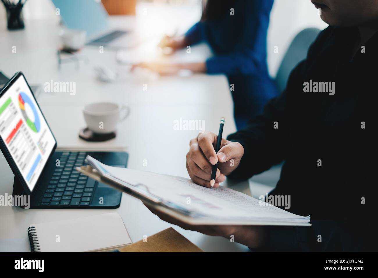 At the office desk, a company team is organizing a successful team