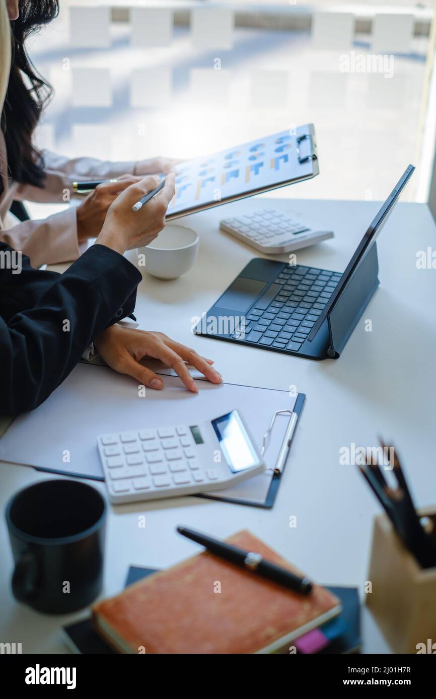 At the office desk, a company team is organizing a successful team