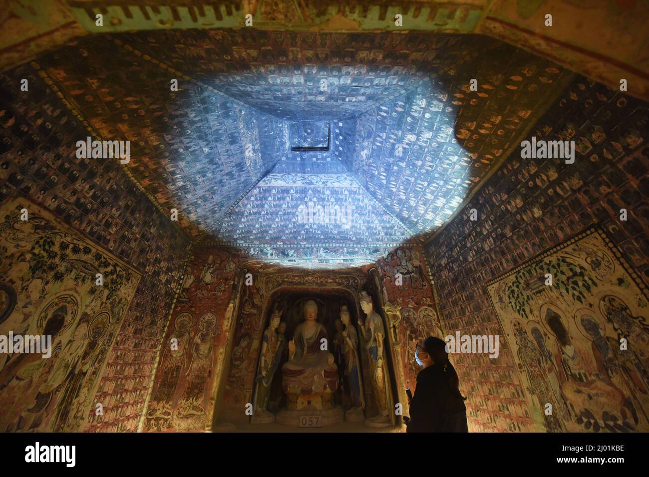 HANGZHOU, CHINA - MARCH 16, 2022 - Visitors view the 3D-printed restoration of Cave 45 of Dunhuang Mogao Grottoes (tang Dynasty) at Zhejiang Art Museu Stock Photo