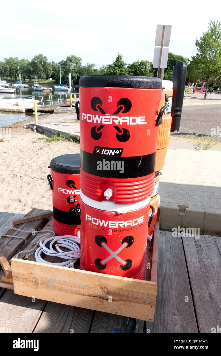 Red barrels of Powerade energy drink on the dock at Lake Bde Maka Ska (was Lake Calhoun). Minneapolis Minnesota MN USA Stock Photo