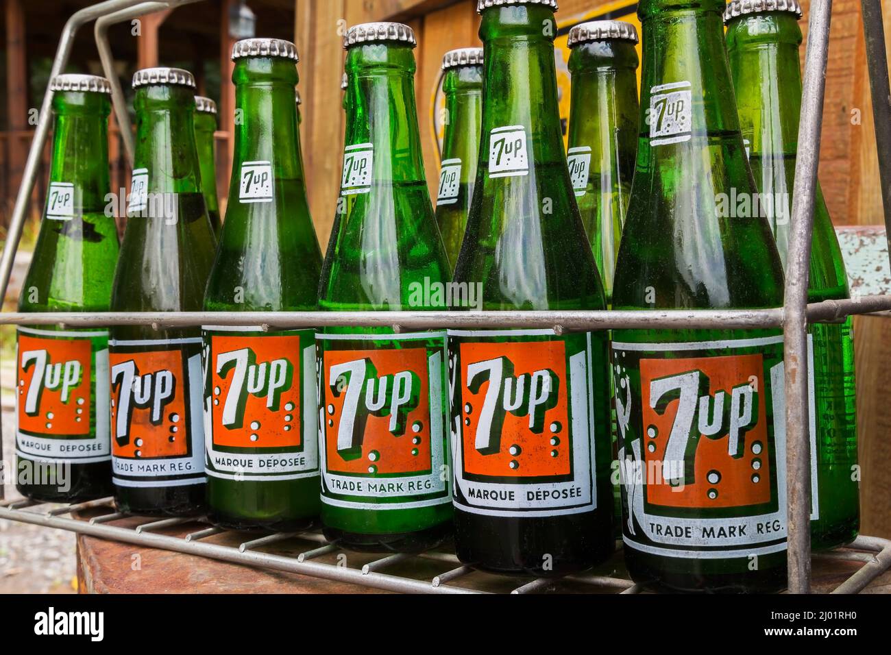 Old English and French language 7 Up soft drink company bottles in