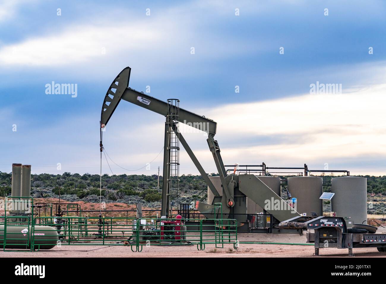 Oil well pump jack unit and storage tank battery Stock Photo Alamy