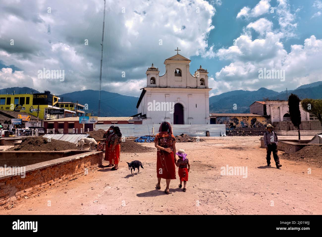 Ixil women in front of the church and main plaza, Nebaj, El Quiché, Guatemala Stock Photo