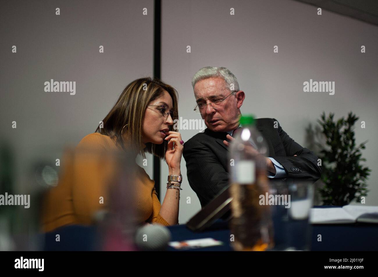 Jennifer Arias, President of Colombia's Chamber of Representatives listens to former Colombian president Alvaro Uribe Velez (2002-2010) during the Centro Democratico political party meeting to choose a path for the 2022 presidential elections in Colombia, after the prelimiary elections, in Bogota, Colombia, March 15, 2022. Photo by: Long Visual Press Stock Photo