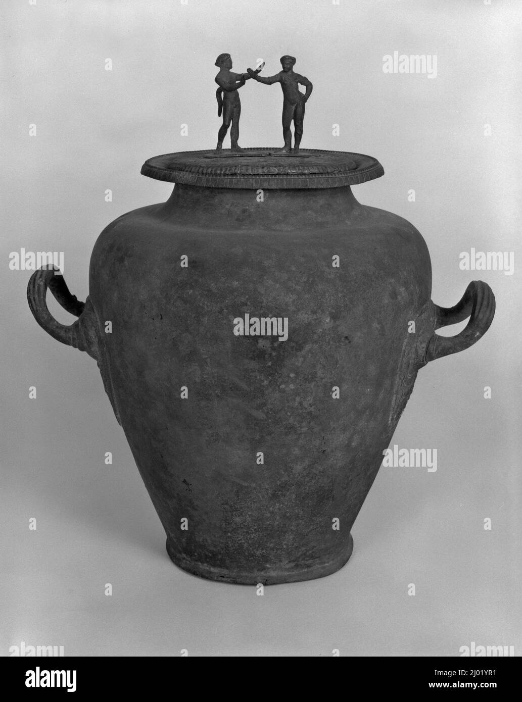 Stamnos and Lid (Mirror) with a Handle in the Form of a Satyr and a Maenad Stock Photo