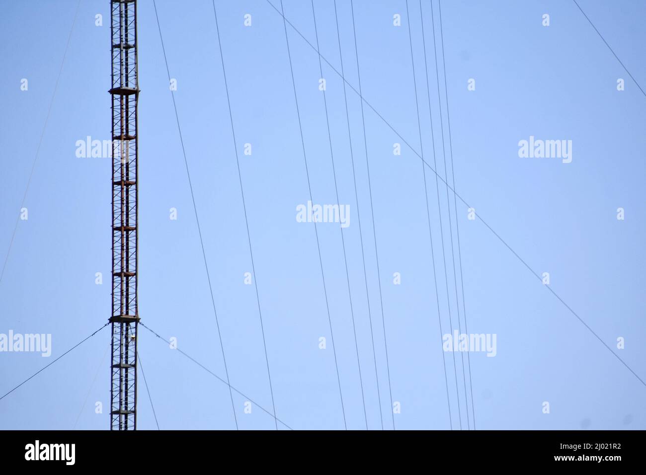 Communication tower against blue sky Stock Photo