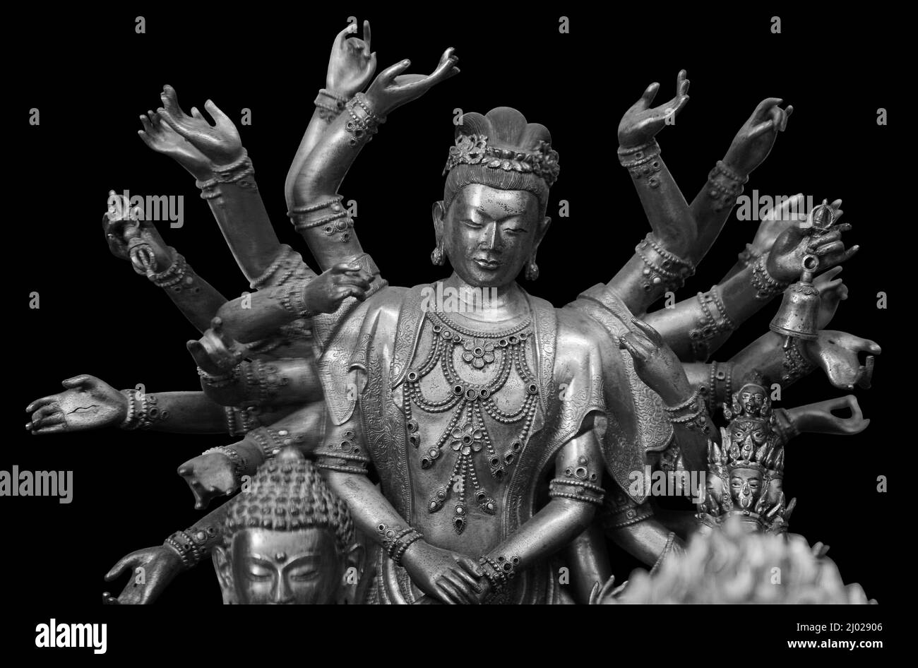 Multi armed Shiva statue isolated on black background with clipping path. Buddha statue with many arms in a Buddhist temple Stock Photo