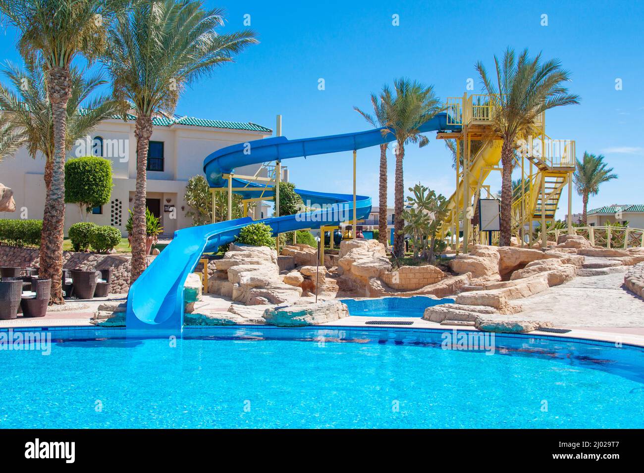 Sharm El Sheikh, Egypt - circa april, 2015: Egyptian hotel resort and spa view with palm trees, swimming pool and blue sky Stock Photo