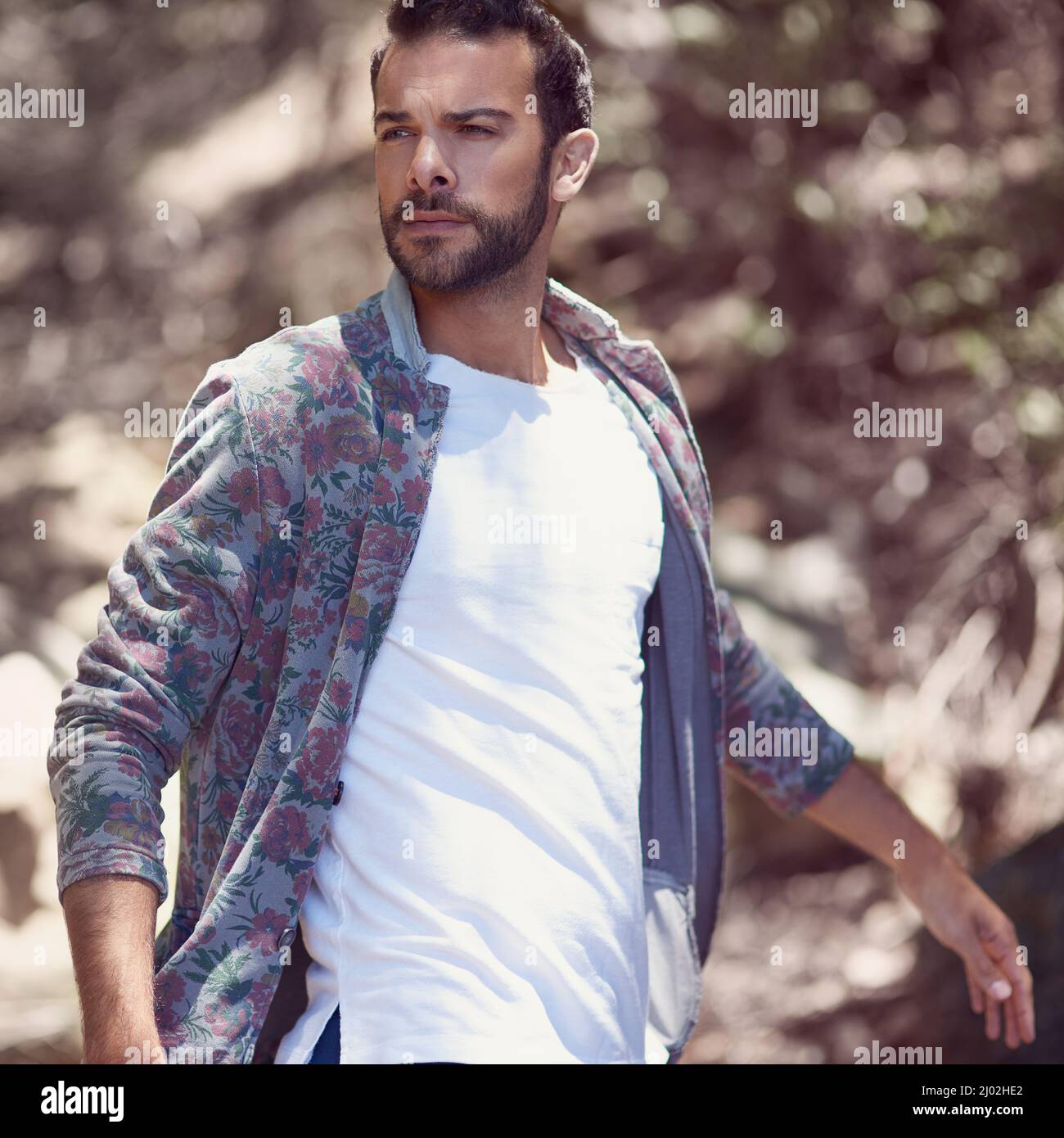 Walking around in style. Shot of a fashionable young man walking outside. Stock Photo