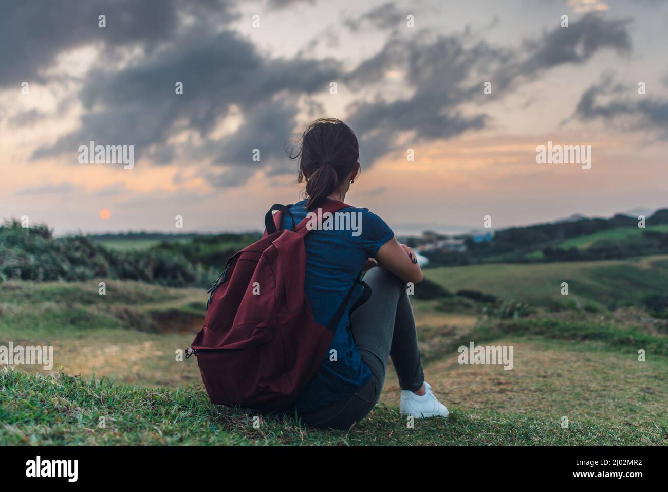 Young woman watching the sunset hi-res stock photography and images - Alamy