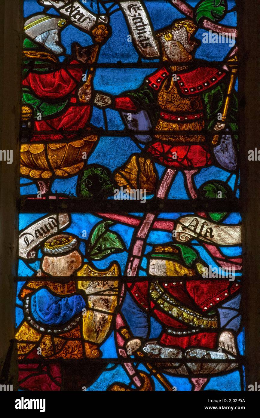 Kings of ancient Israel and Judah, identified by their crowns and sceptres, are among more than 40 biblical characters supported by daisy-like blossoms sprouting from the branches of a colourful stained glass Tree of Jesse, a visual guide to the ancestors of Christ, installed in 1512 in a window of the Église Saint-Rémi at Ceffonds, a village in the Champagne region of northeast France. Stock Photo