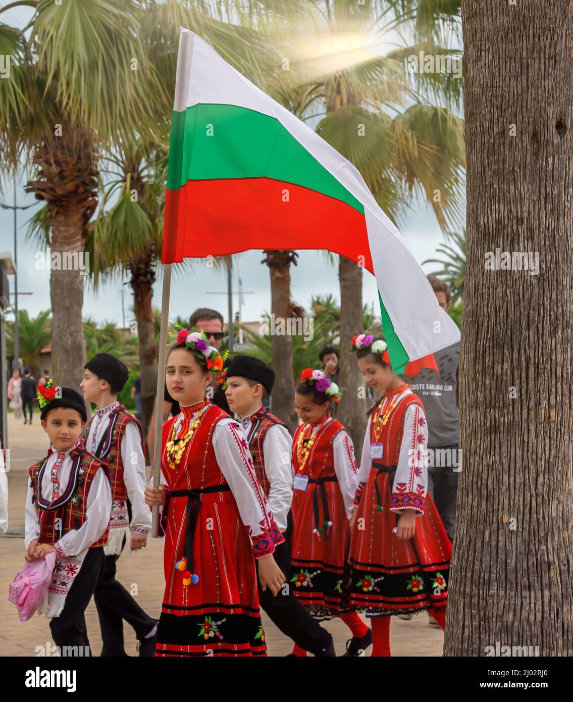 Girl holding Bulgaria flag in ethnic, traditional Bulgarian clothes. Natinonal flag, patriotism concept. Batumi, Georgia - May 2019 Stock Photo
