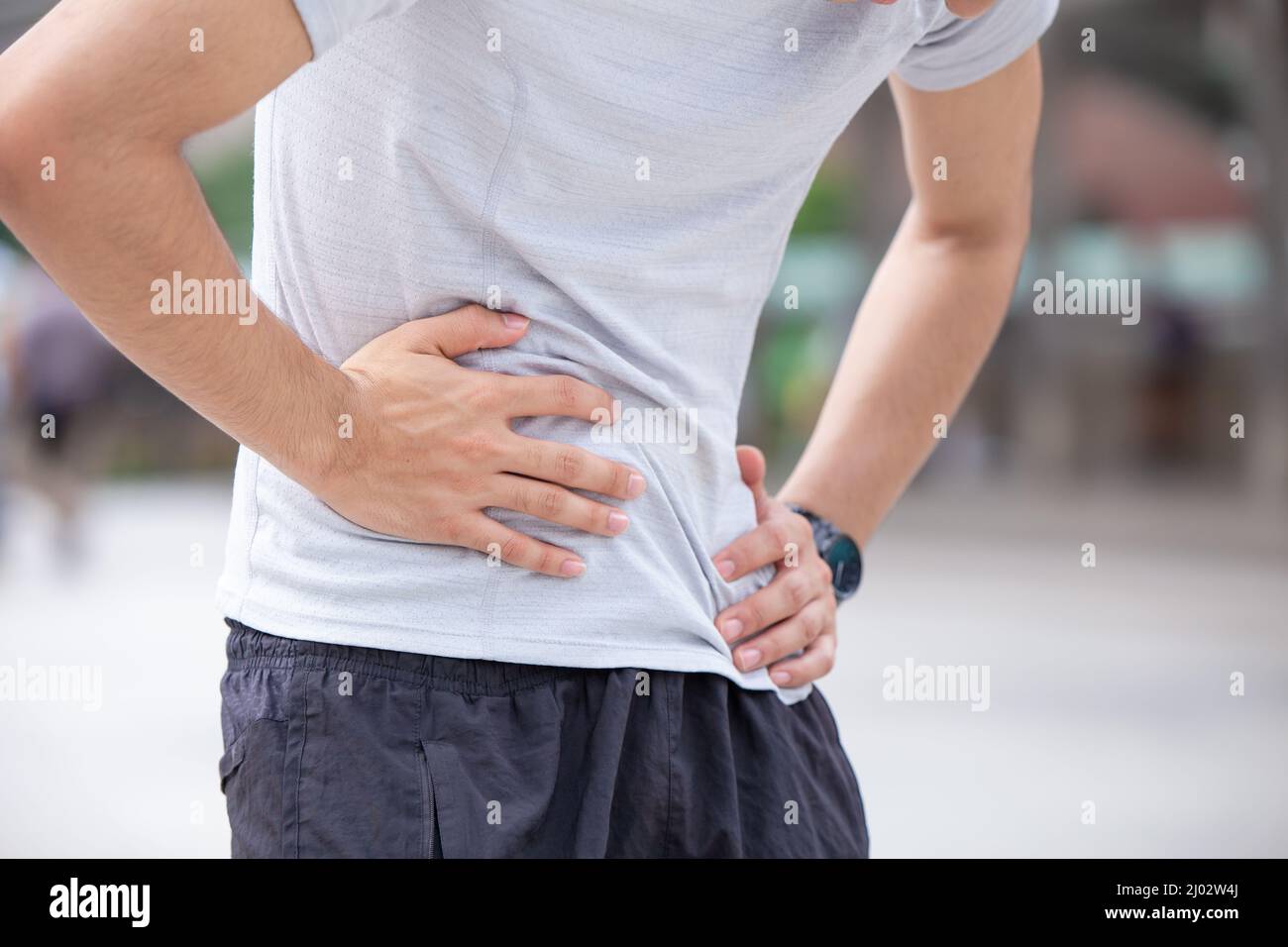young man suffering from gastritis abdominal pain due to flatulence