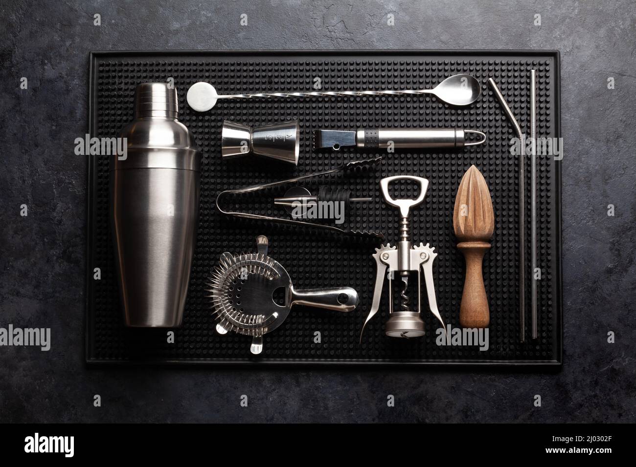 Various cocktail utensil set. Shaker, strainer, juicer. Top view flat