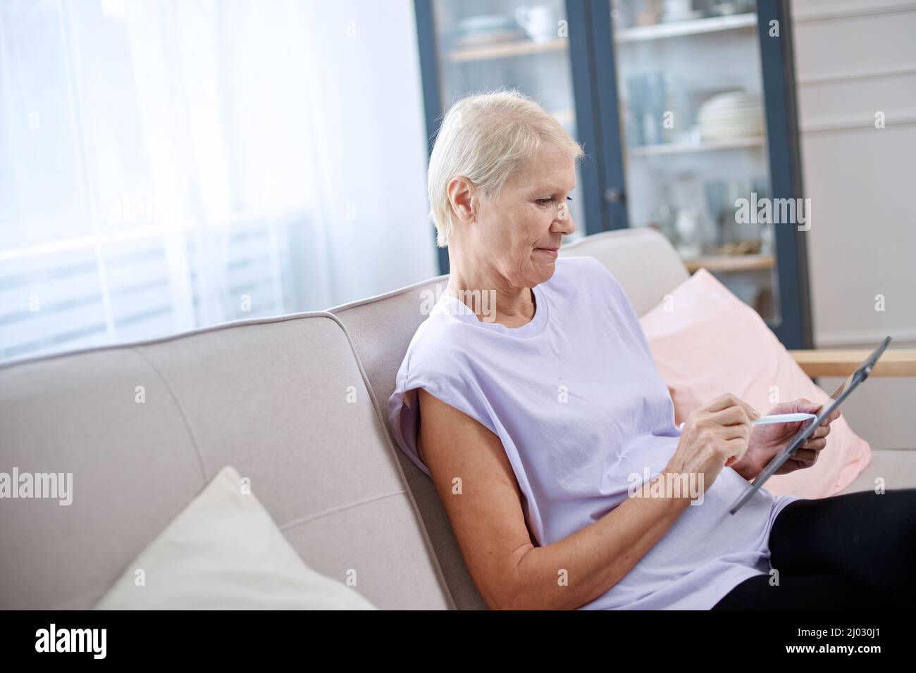 elderly woman is a designer doing some work. Stock Photo