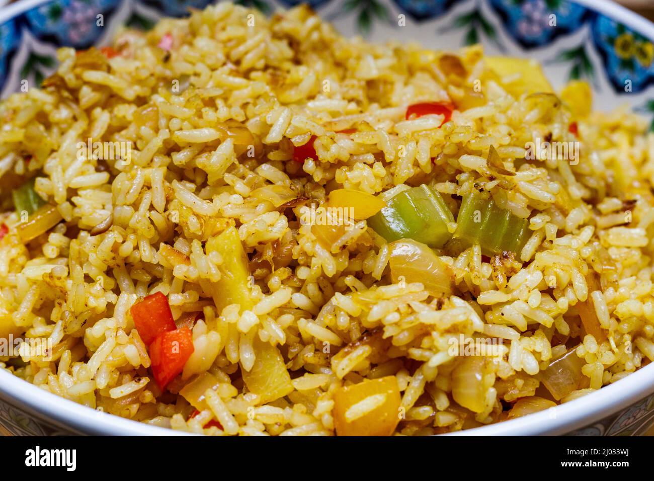 Caribbean fried rice with peppers and celery Stock Photo Alamy