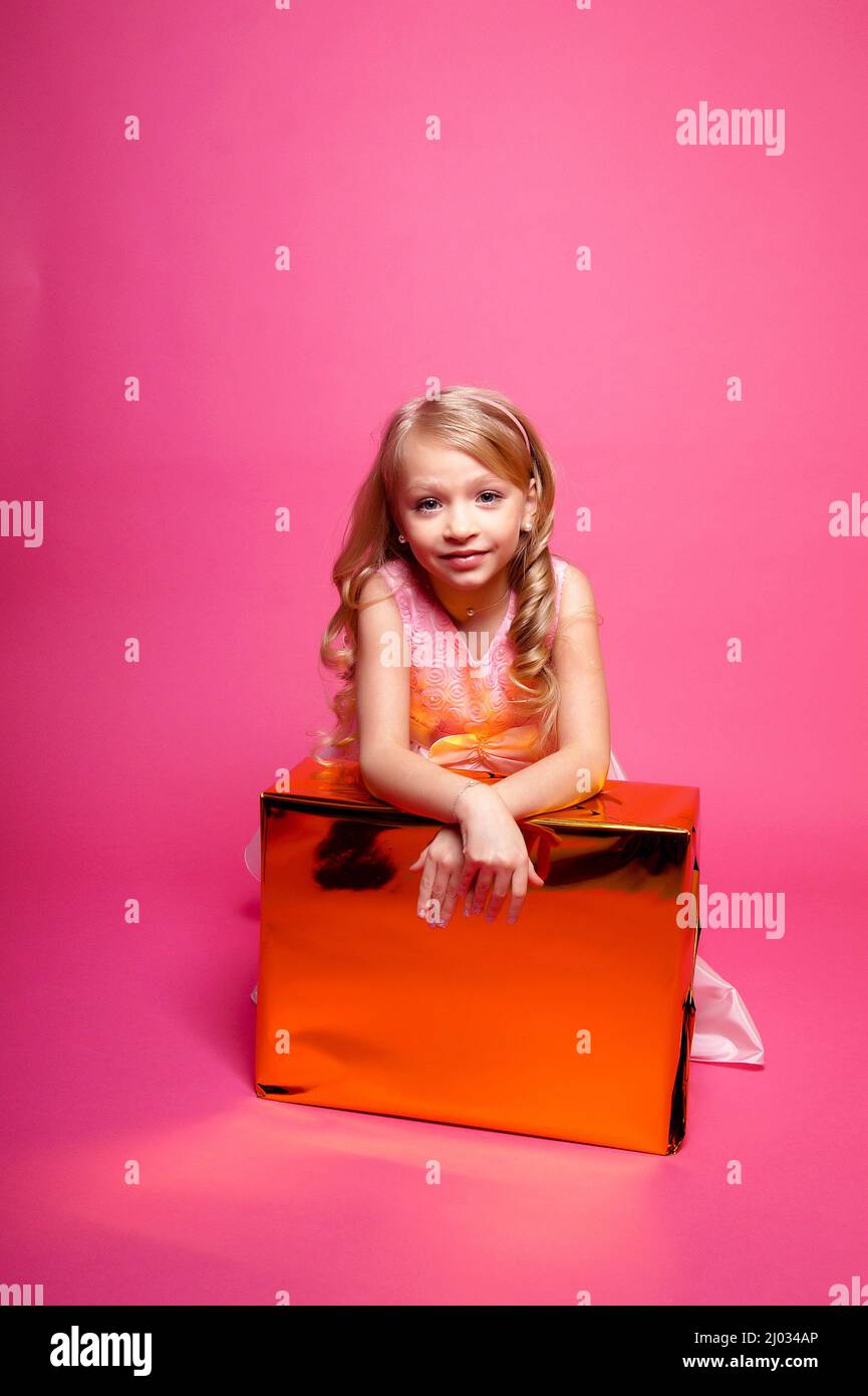 Pretty young kid girl in pink dress.Isolated studio shot Stock Photo ...