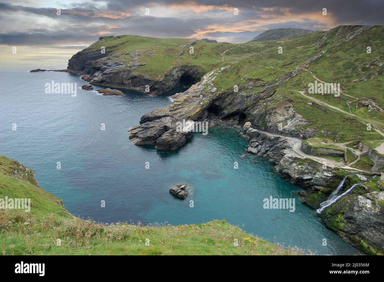 Merlin’s Cave in the bay beside Tintagel in north coast of Cornwall, UK, a centre of British legends about King Arthur. Stock Photo