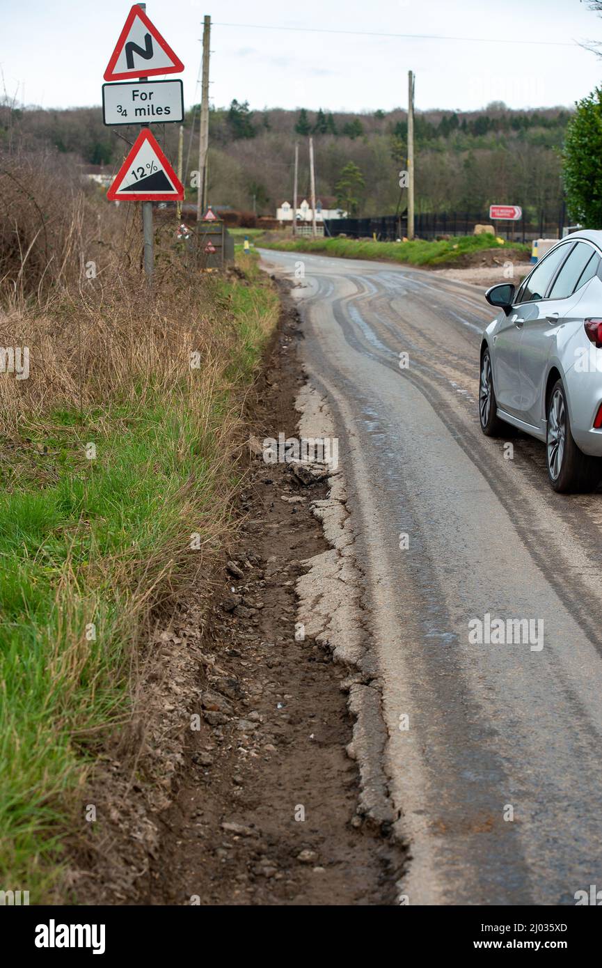 Wendover, Buckinghamshire, UK. 15th March, 2022. The aptly named Rocky Lane. Many of the roads near HS2 sites are now in a very bad state of repair due to the number of HS2 contractor lorries and heavy machinery using the roads. Credit: Maureen McLean/Alamy Live News Stock Photo