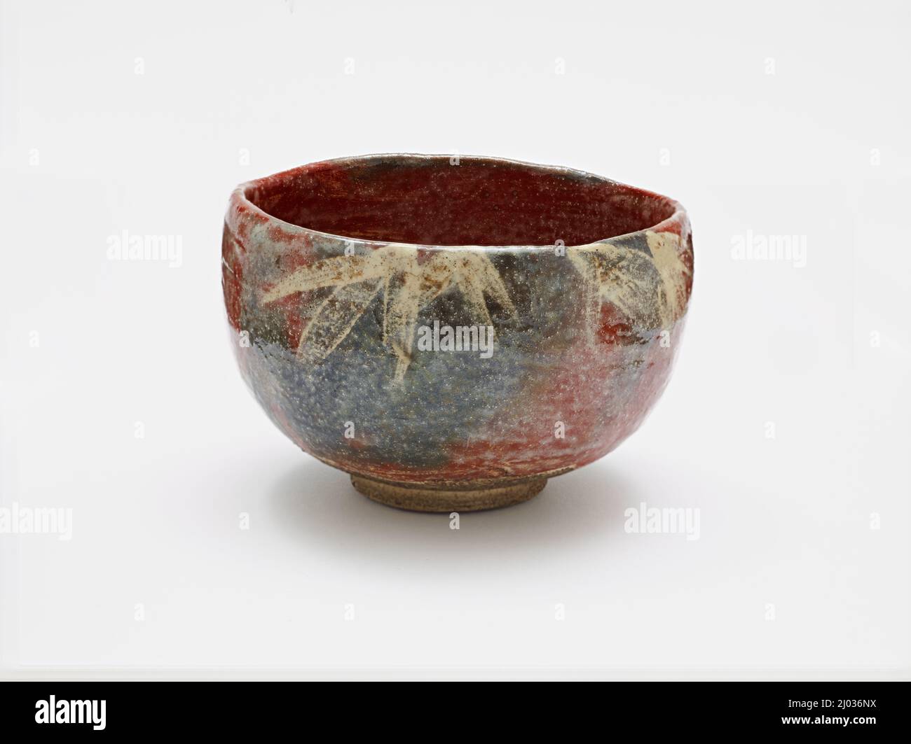 Red Raku Tea Bowl with Design of Snow-frosted Bamboo. Ryōnyū (Raku IX) (Japan, 1756-1834). 1809. Ceramics. Raku ware; glazed earthenware Stock Photo