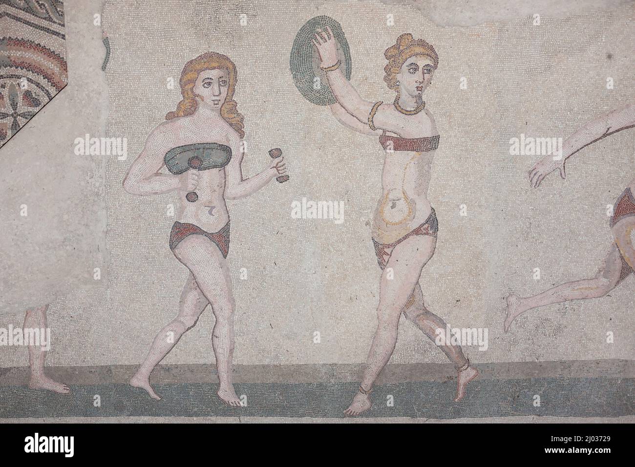 Mosaics of female gymnasts, The Roman Villa del Casale (Villa Romana del Casale), UNESCO World Heritage Site, Piazza Armerina, Enna, Sicily, Italy Stock Photo