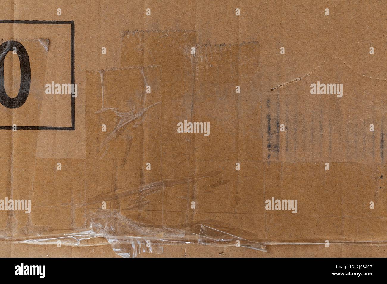 Worn cardboard texture with clear tape Stock Photo Alamy