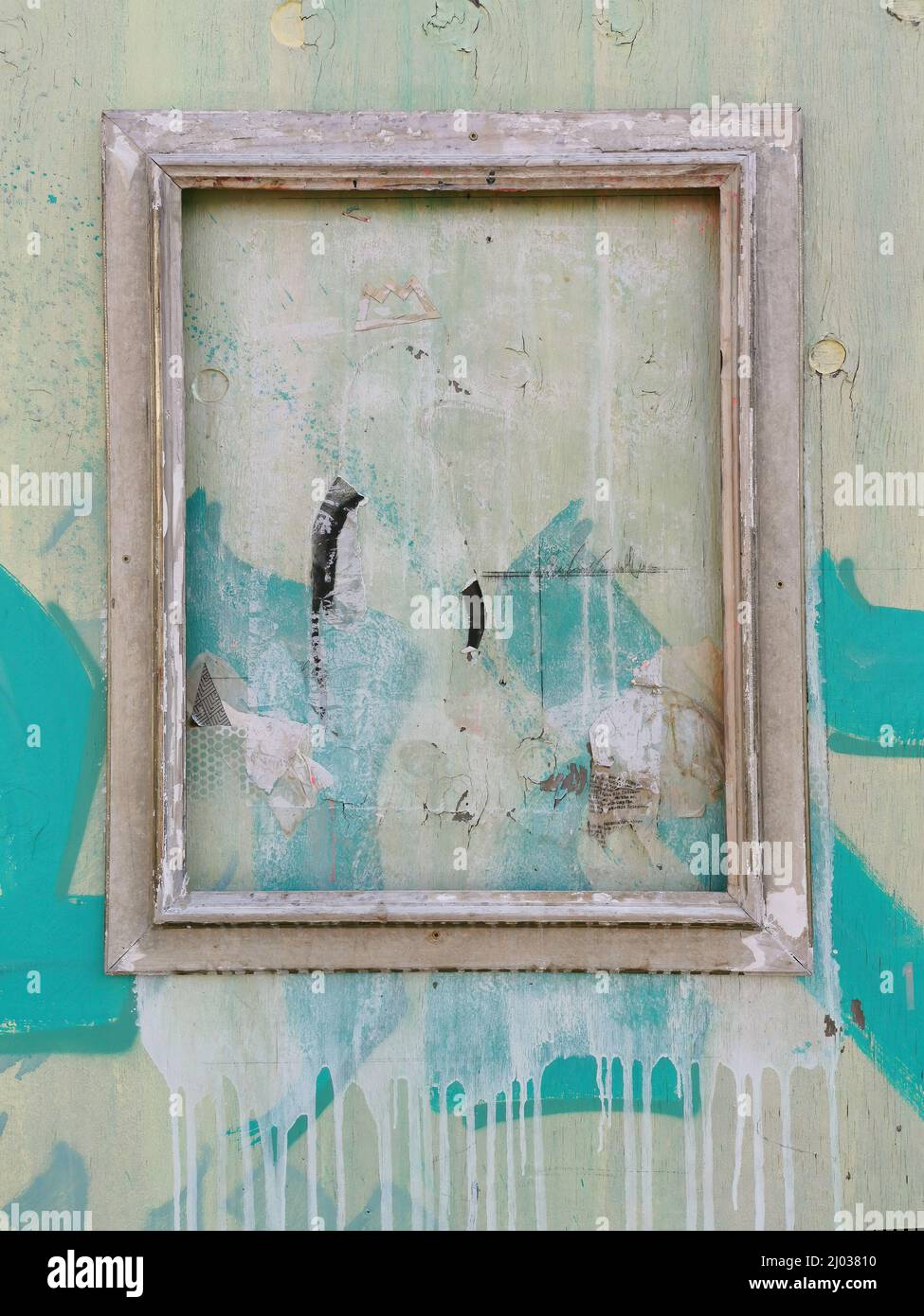 verwitterter Bilderrahmen an einer Holzwand  /  weathered picture frame on a wooden wall Stock Photo