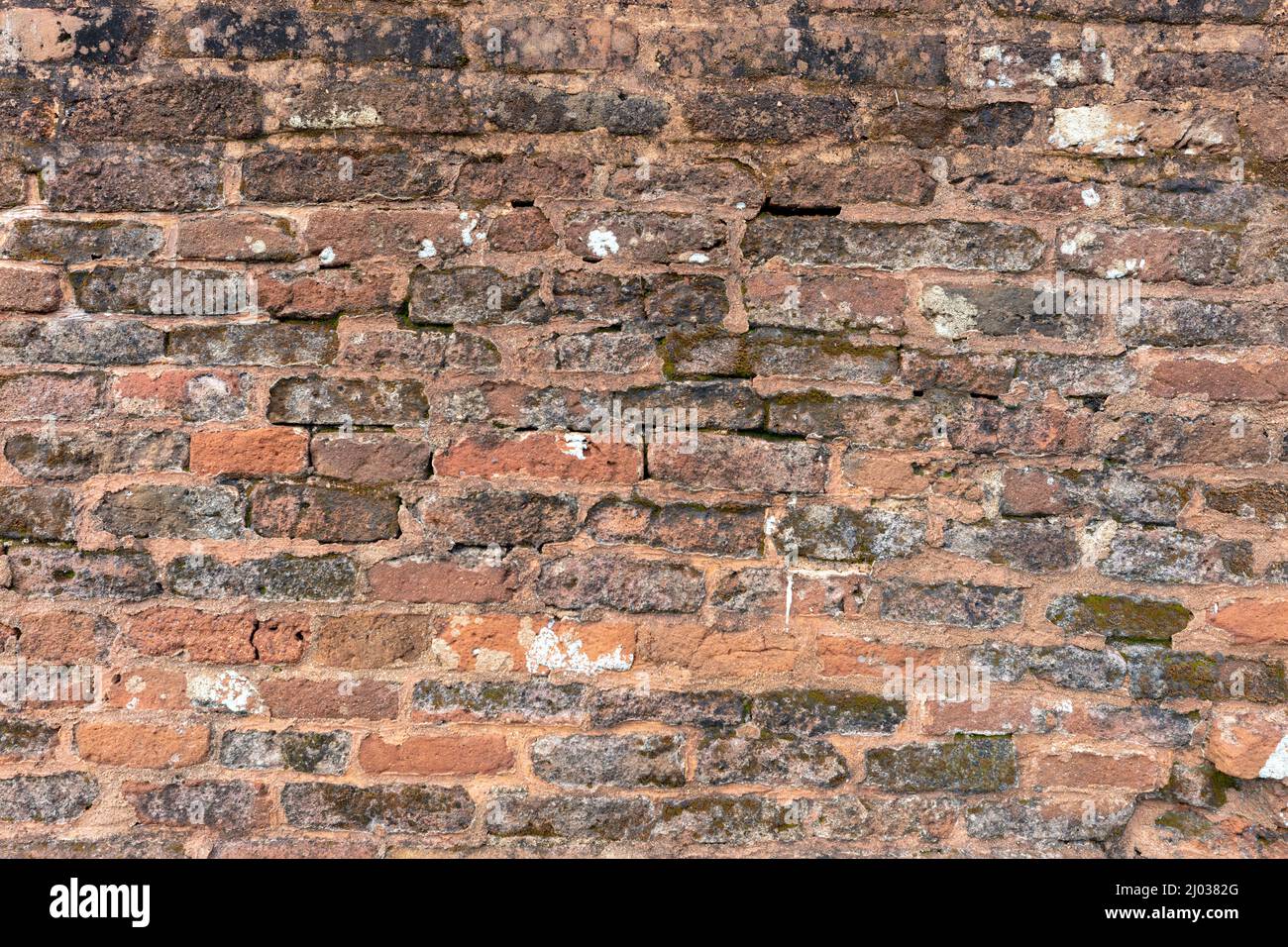 Vintage brick wall background, unique relief texture. Stock Photo