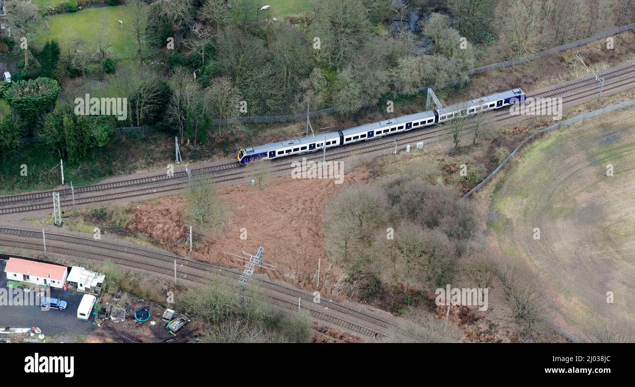An aerial view of a Northern Rail Passenger train, south of Wigan, North west England, UK Stock Photo