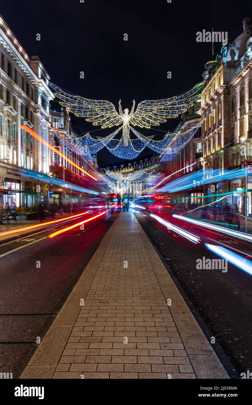 Christmas decorations in Regent Street with light trails, London