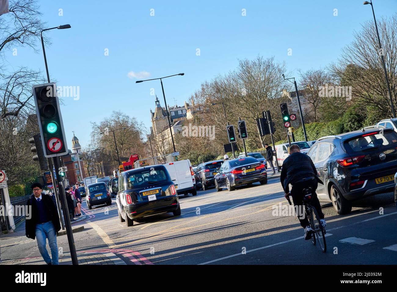 Cyclist in Traffic congestion, Marylebone Road, London, Uk Stock Photo