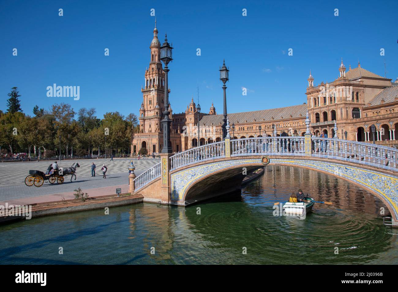 A horse with cart and rowboat touring Plaza de Espana, Seville