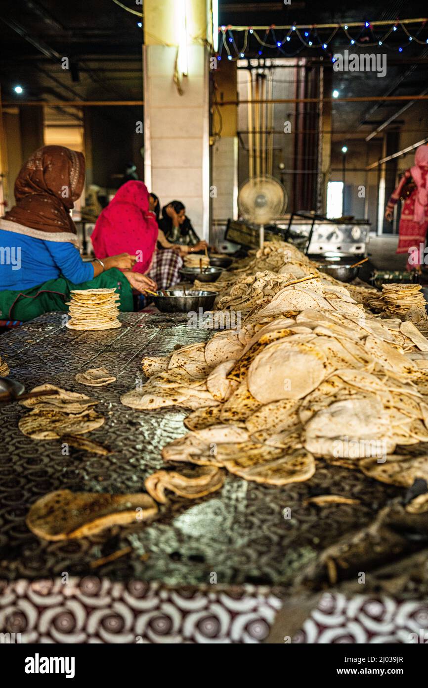 A pile of fresh roti being sorted at the Golden Temple, Amritsar, Punjab, India, Asia Stock Photo