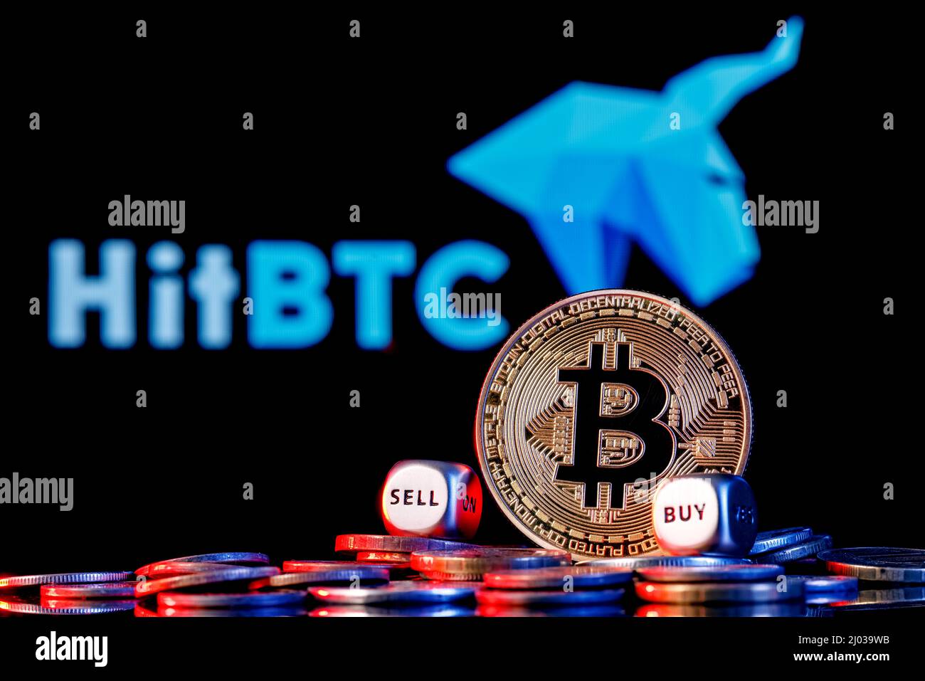 Golden bitcoin with two buy-sell cubes in a pile of coins on the background  of the HitBTC logo. The concept of buy-sell choice Stock Photo - Alamy
