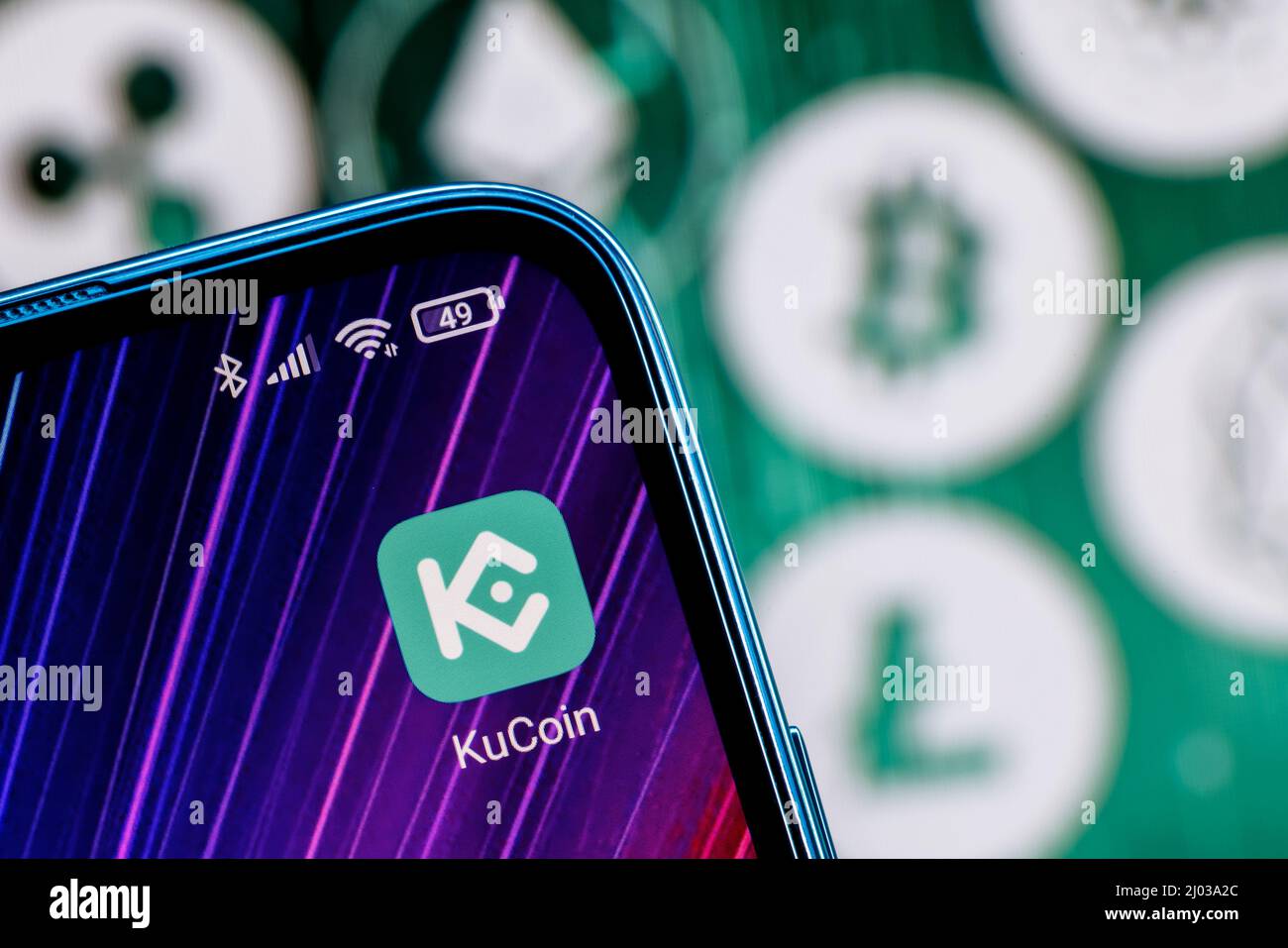 KuCoin is cryptocurrency exchange. KuCoin app on smartphone screen ...