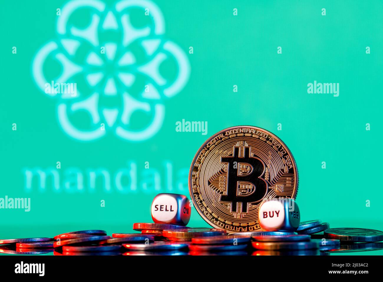 Golden bitcoin with two buy-sell cubes in a pile of coins on the background  of the Interactive Broker logo Stock Photo - Alamy