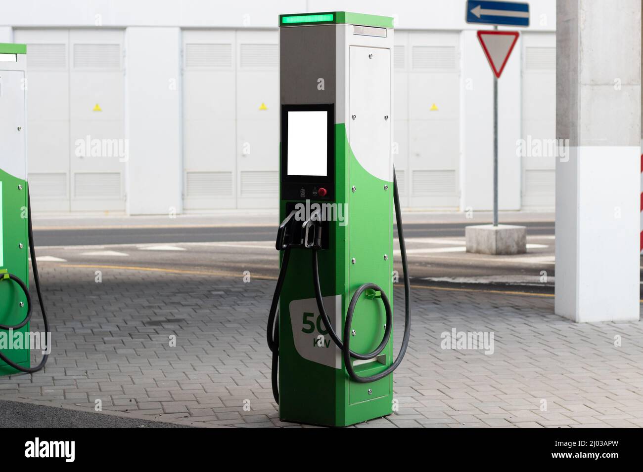 Public charging station for charging the battery of modern electric vehicles with mockup Stock