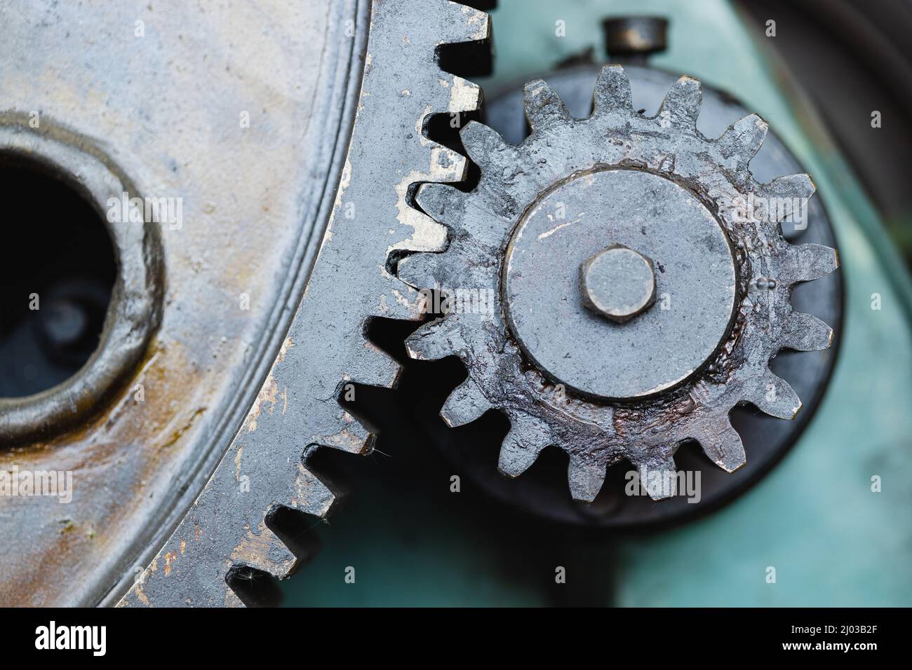 Metal gear cogwheel in steel heavy industry machine with dirty grease oil lube Stock Photo