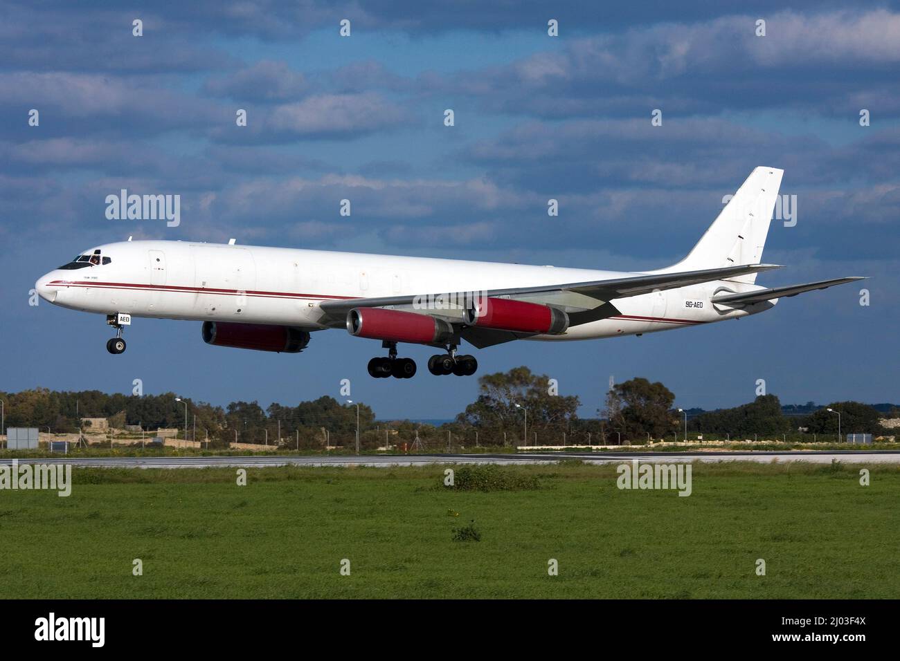 Air Charter Express McDonnell Douglas DC-8-62AF [9G-AED] landing runway 31 on a sunny winter afternoon. Stock Photo