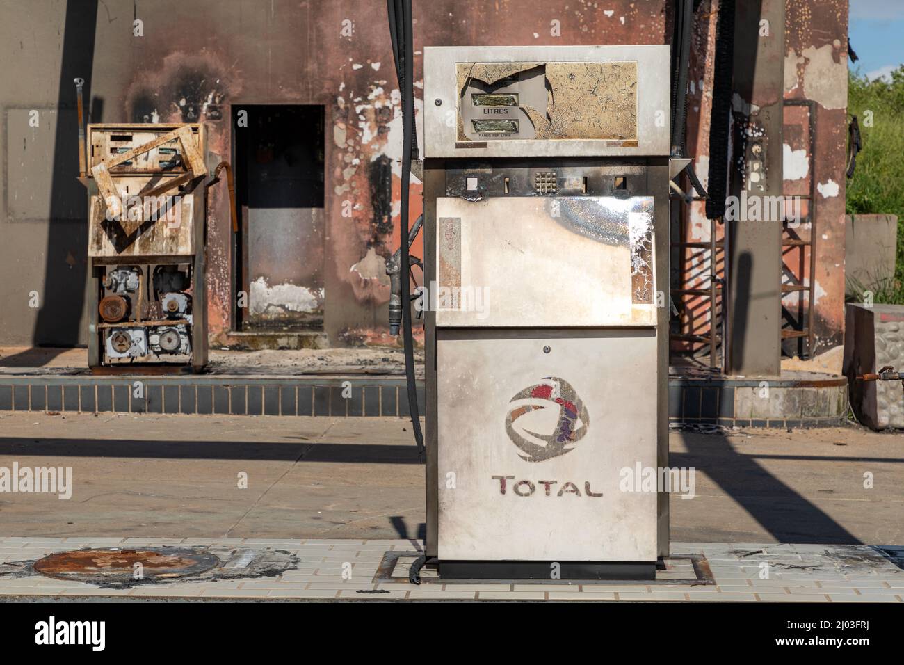 The burned pumps of the Total Fuel station after a lightning strike. The fire occurred on 13 November 2021 Stock Photo