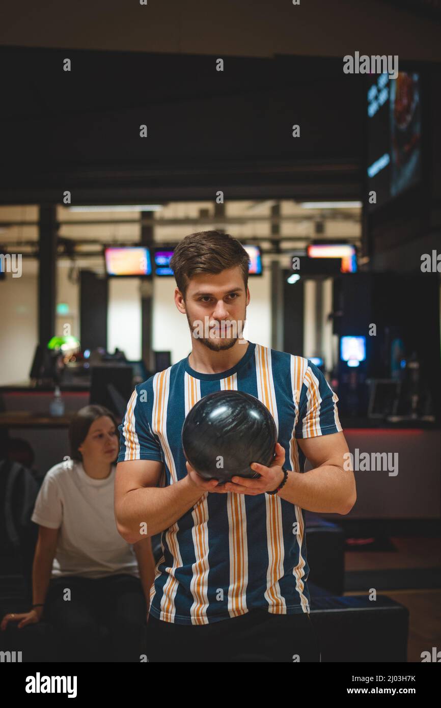 Professional bowler throws his throw and is in position to watch his ball. Bowling life. An