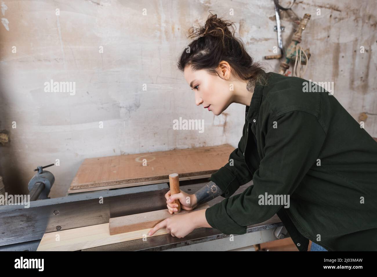 Side view of woodworker using jointer machine Stock Photo Alamy