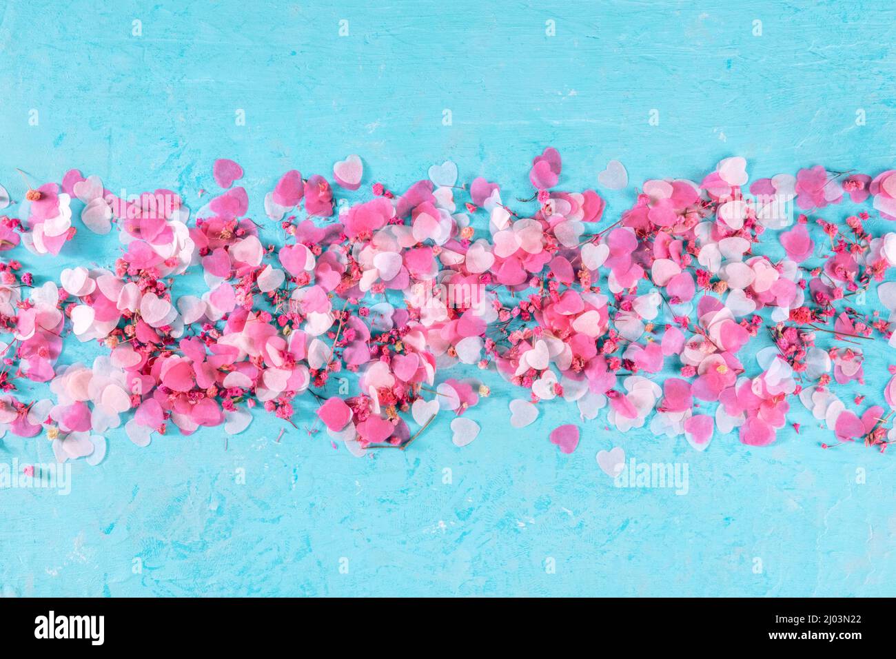 Valentine day or wedding romantic background with pink hearts on a blue ...