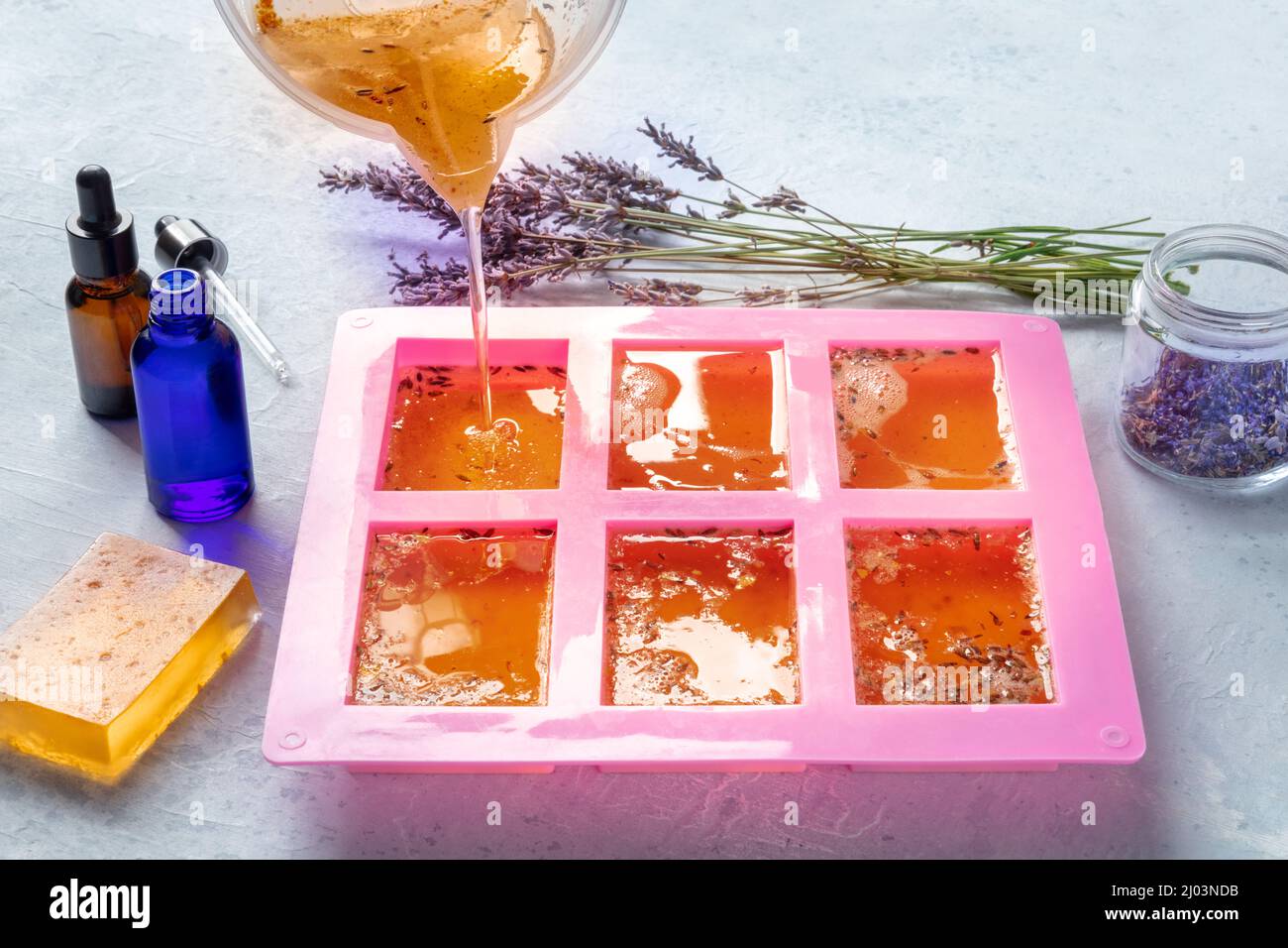 Making soap from pour and melt soap base concept. Soap making ingredients  on brown wooden background. melt and pour method, buy a soap base Stock  Photo - Alamy
