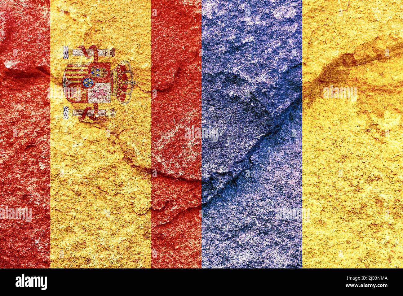 Vintage Spain and Ukraine vertical national flags isolated together on solid rock wall background Stock Photo