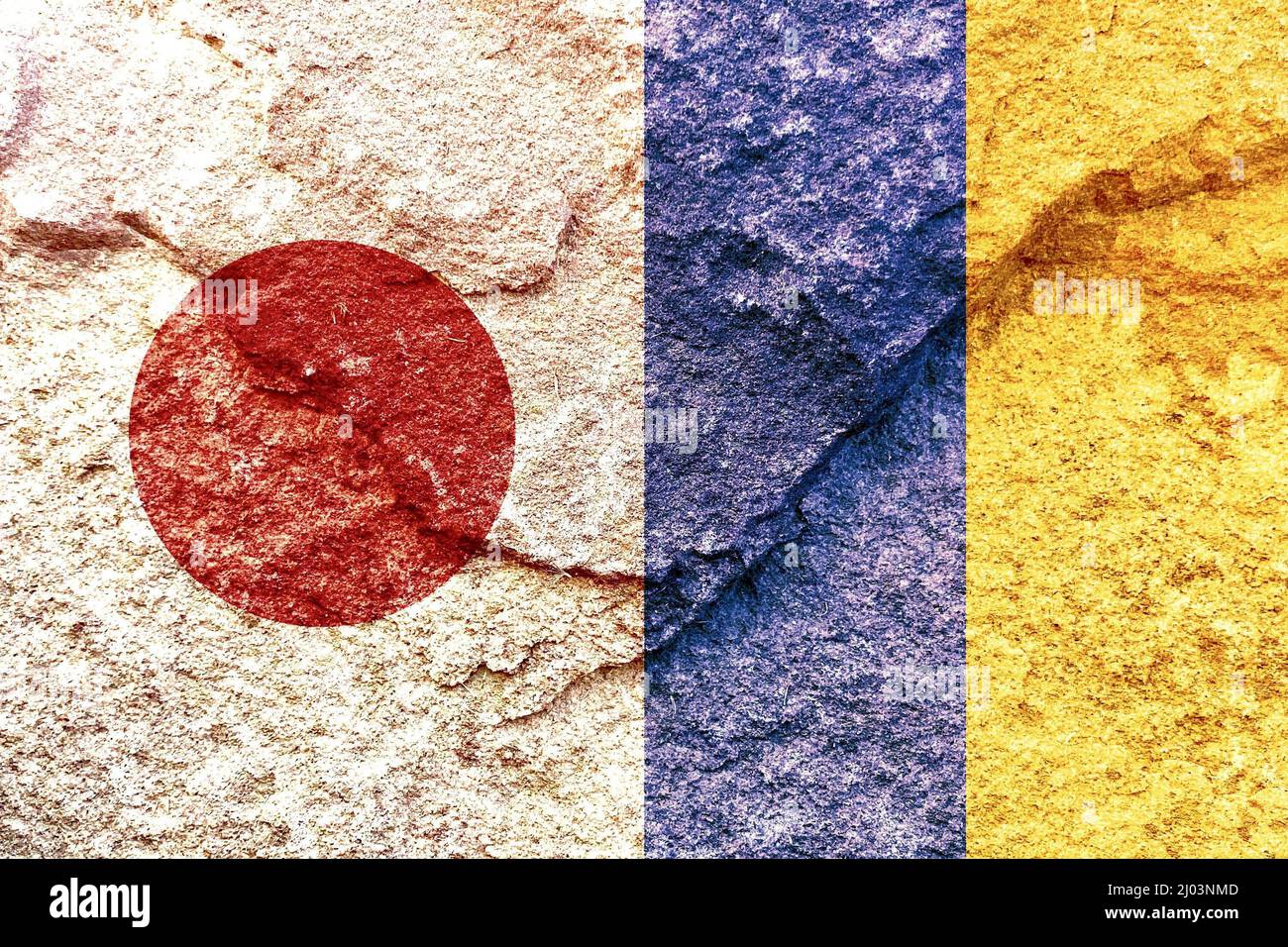 Vintage Japan and Ukraine vertical national flags isolated together on solid rock wall background Stock Photo