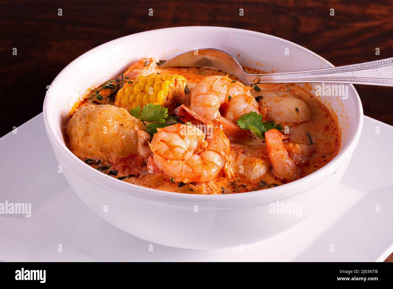 Peruvian shrimp and corn chowder in a white bowl Stock Photo Alamy
